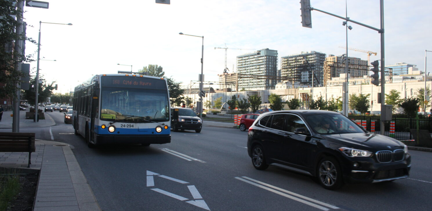 City bus traveling in a bus lane on Robert-Bourassa Boulevard in Montreal Quebec