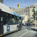 City buses traveling in a reserved bus lane on Boulevard Robert-Bourassa in Montreal Quebec