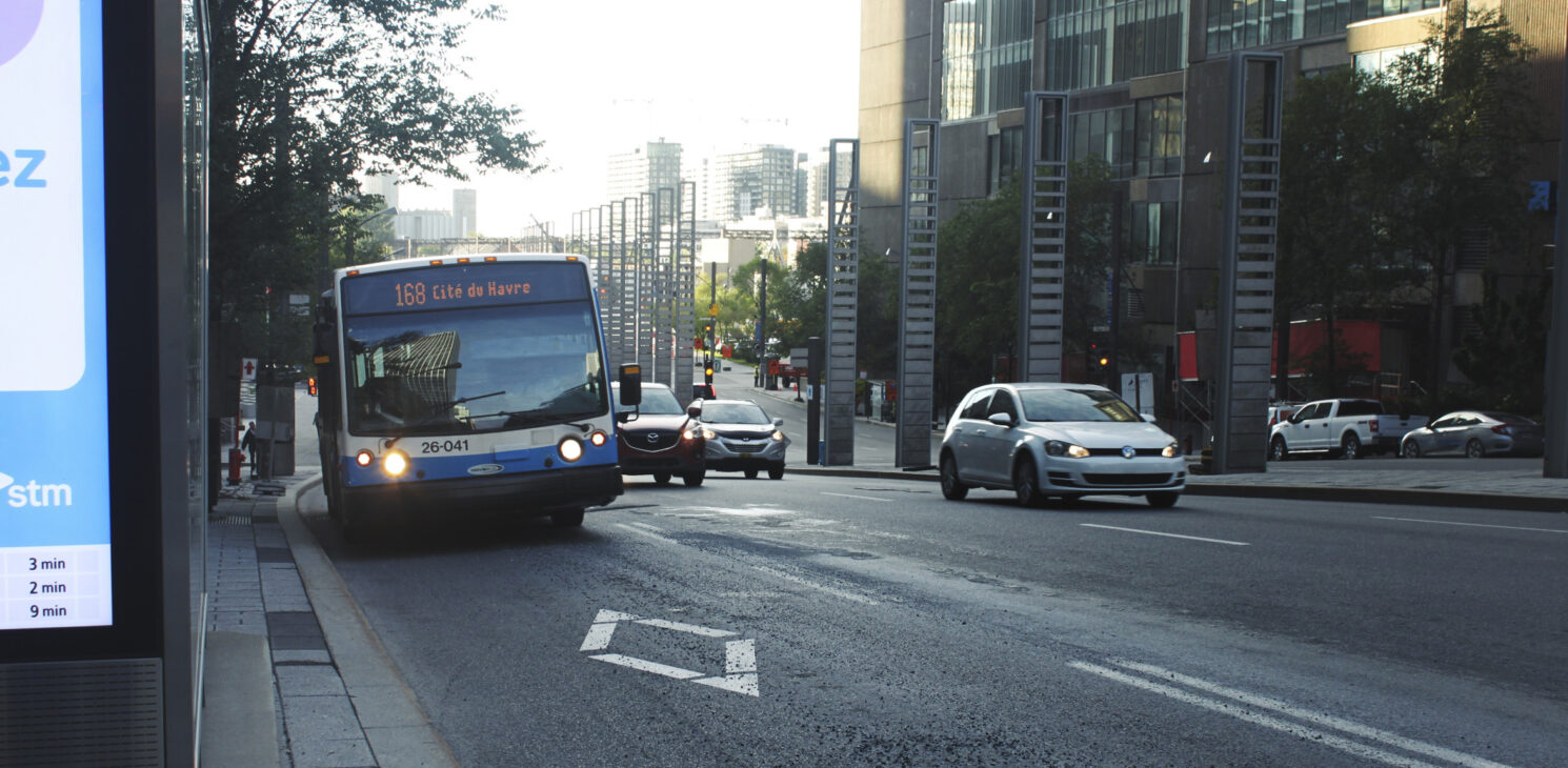 City bus traveling in a reserved lane on Robert-Bourassa Boulevard in Montreal Quebec