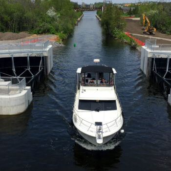 Boat crossing the Nassau Guard Gate at the entrance to the Trent Canal in Peterborough
